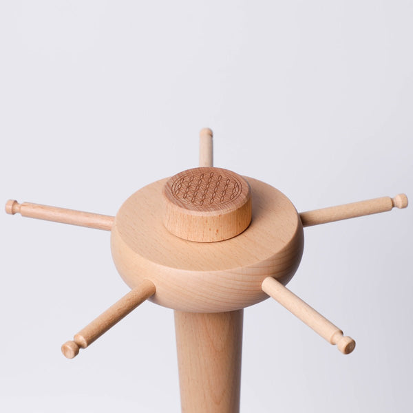 Zenmotion Chime Stand from Gaiachimes, close up of rotatiny disc where you can hang the chimes on, Flower of Life engraving, spiritual geometry,