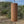 Koshi Mountain chime in walnut against a hillside landscape, video with the original sound of the Earth Symphony collection