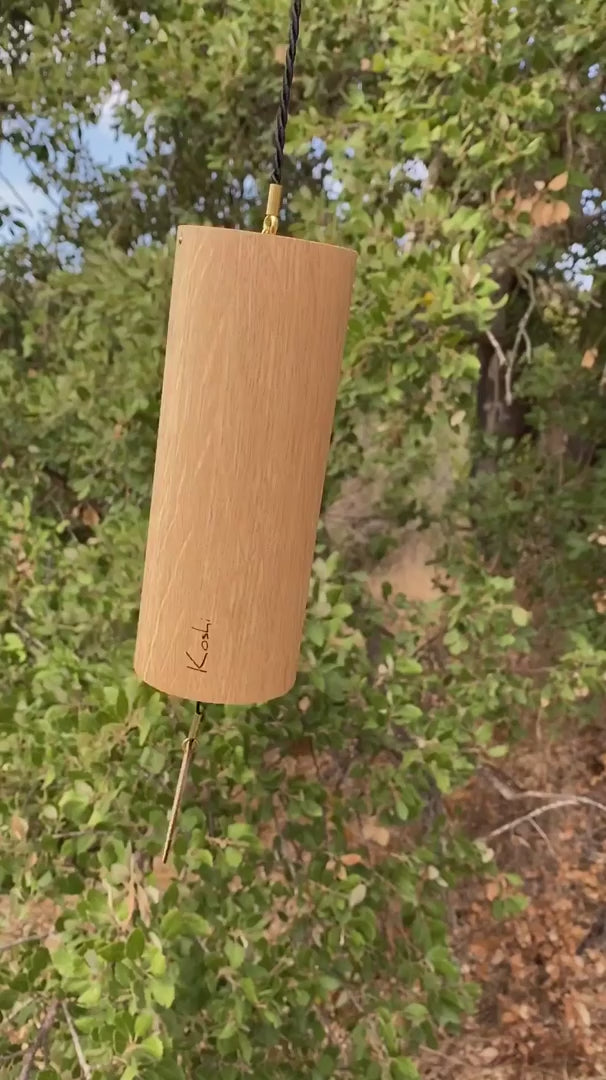 Koshi Forest chime in oak hanging outdoors among green trees, video with the original sound of the Earth Symphony collection